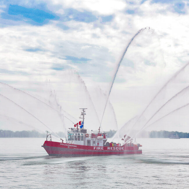 Boat spraying water at the Redpath Waterfront Festival 2022